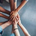 Hands together to volunteer